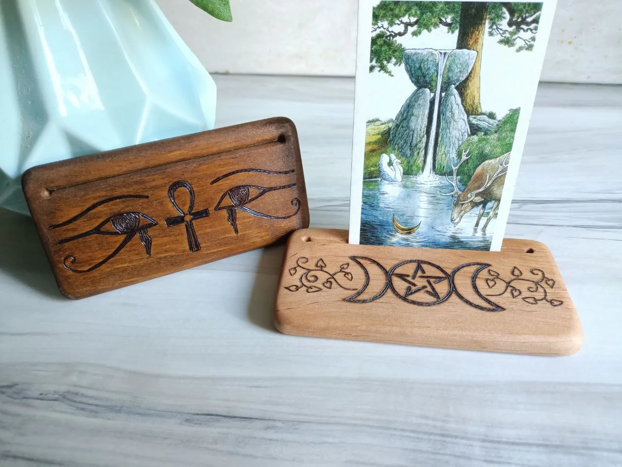 Two tarot holders with Wildwood Tarot card.