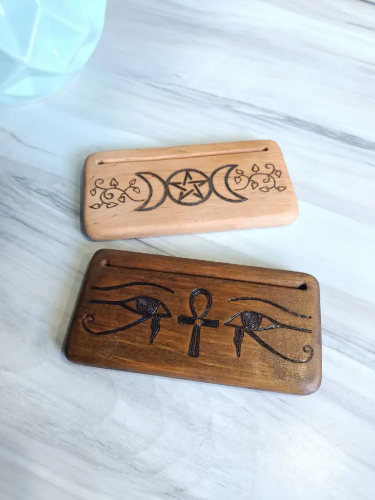 Egyptian dark wood card holder along with Triple goddess light wood card holder