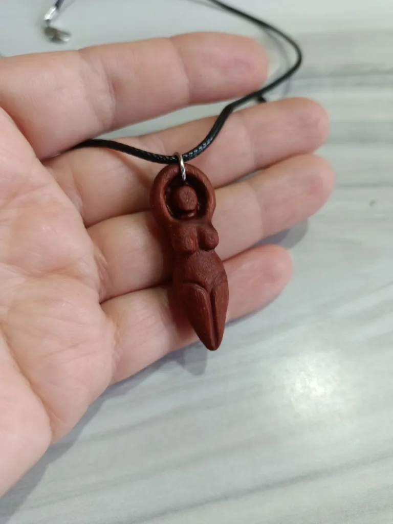 Magic Mother goddess necklace on hand