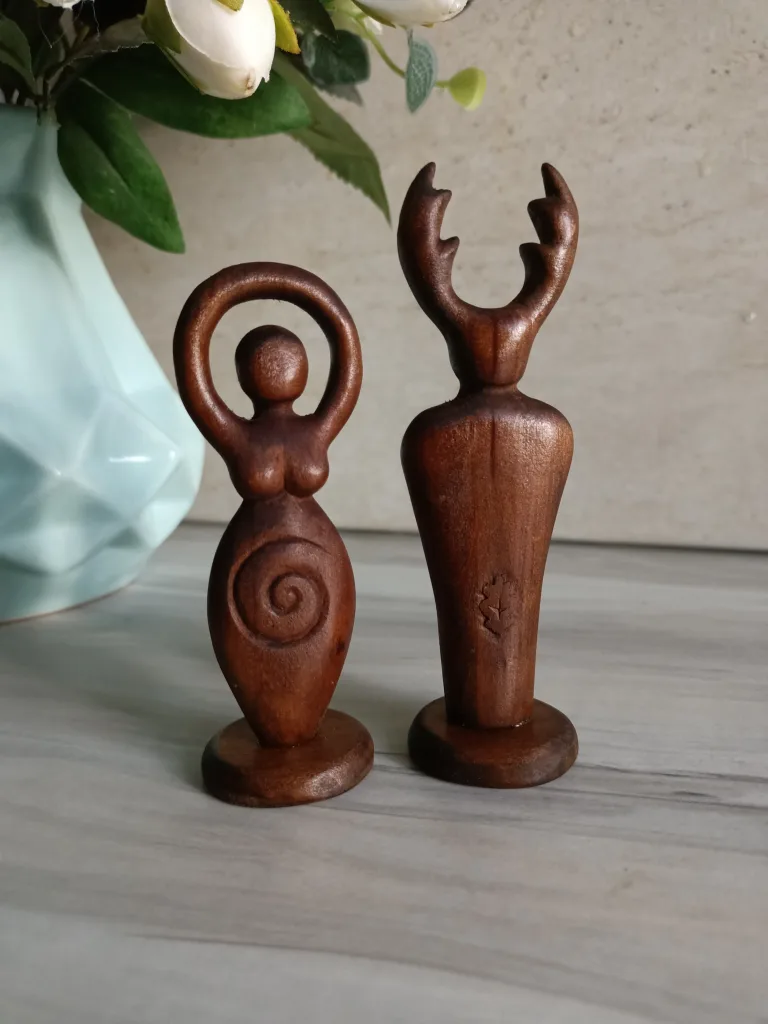 Dark brown goddess and god figures